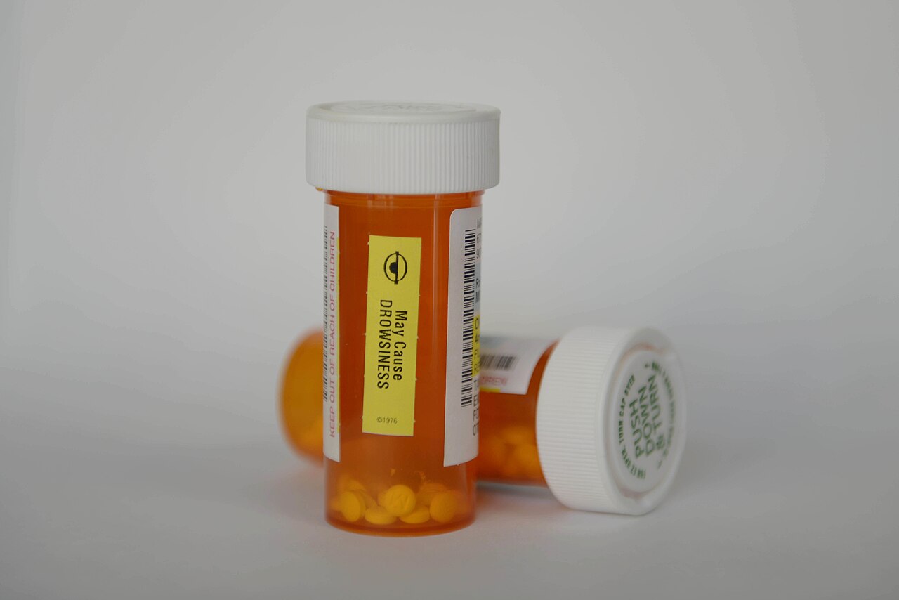 Orange prescription bottles on a table