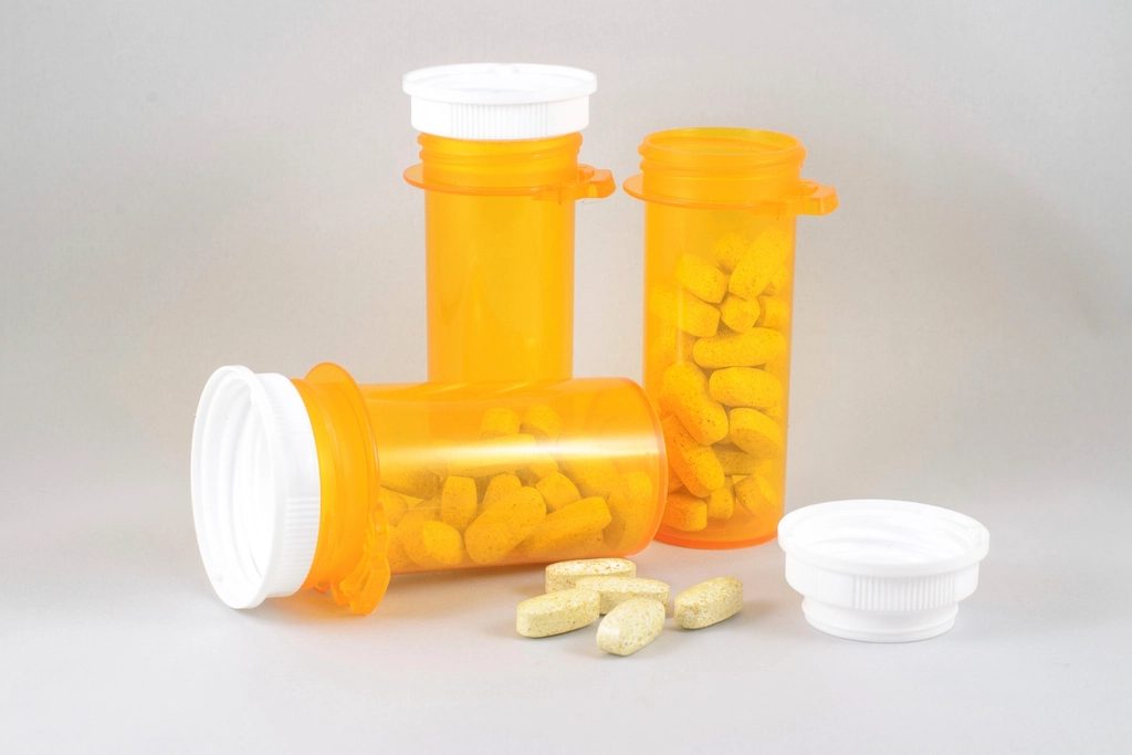 Orange prescription bottles and pills